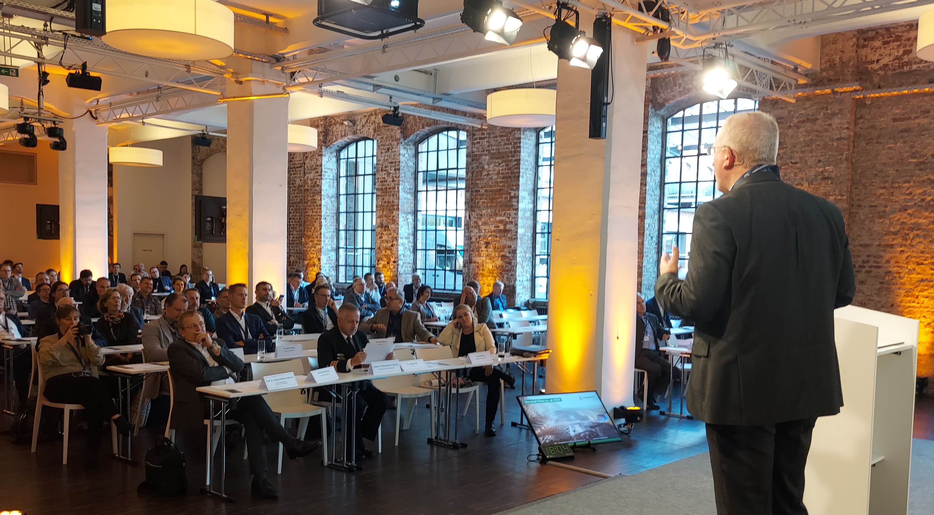 Oskar von Stryk stands in front of experts holding his presentation